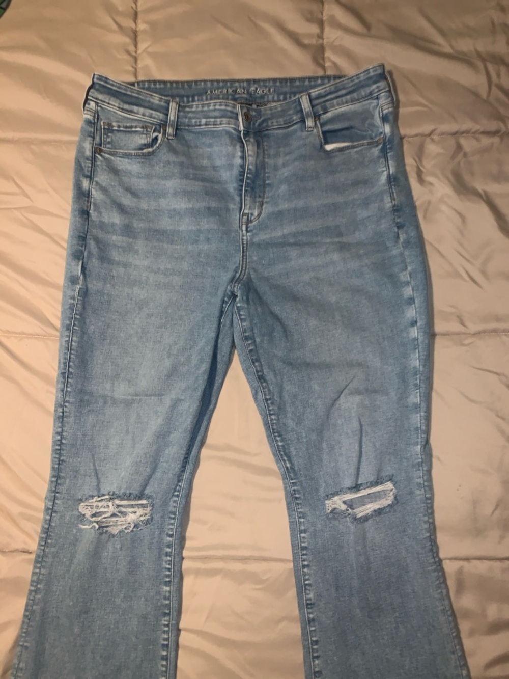 American Eagle Outfitters Light Blue Flare Jeans with Knee Rips